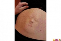 صورة وجه بشري على بطن إمرأة حامل صور