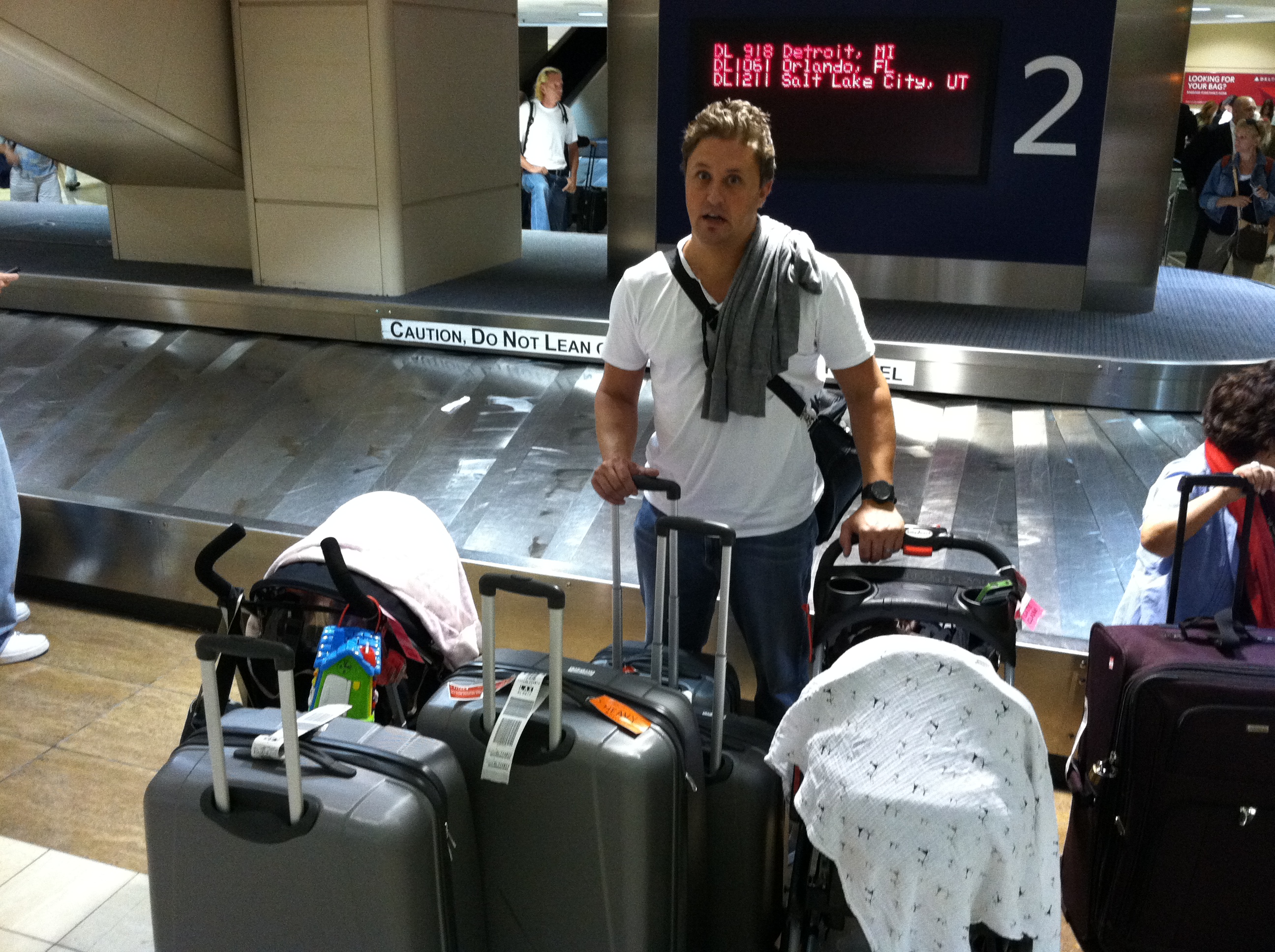 DIDS-20-adrian-with-luggage-at-airport