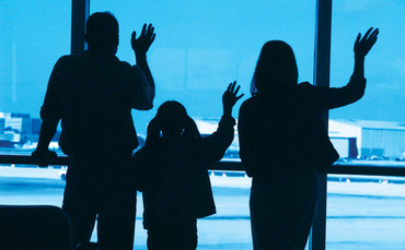 waving-farewell-airport-family-370x229