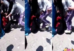 بالفيديو صينية تضرب والدتها المعاقة فى الشارع