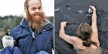رجل يسبح وسط الماء المتجمد لينقذ بطة متجمدة من الموت بالصور