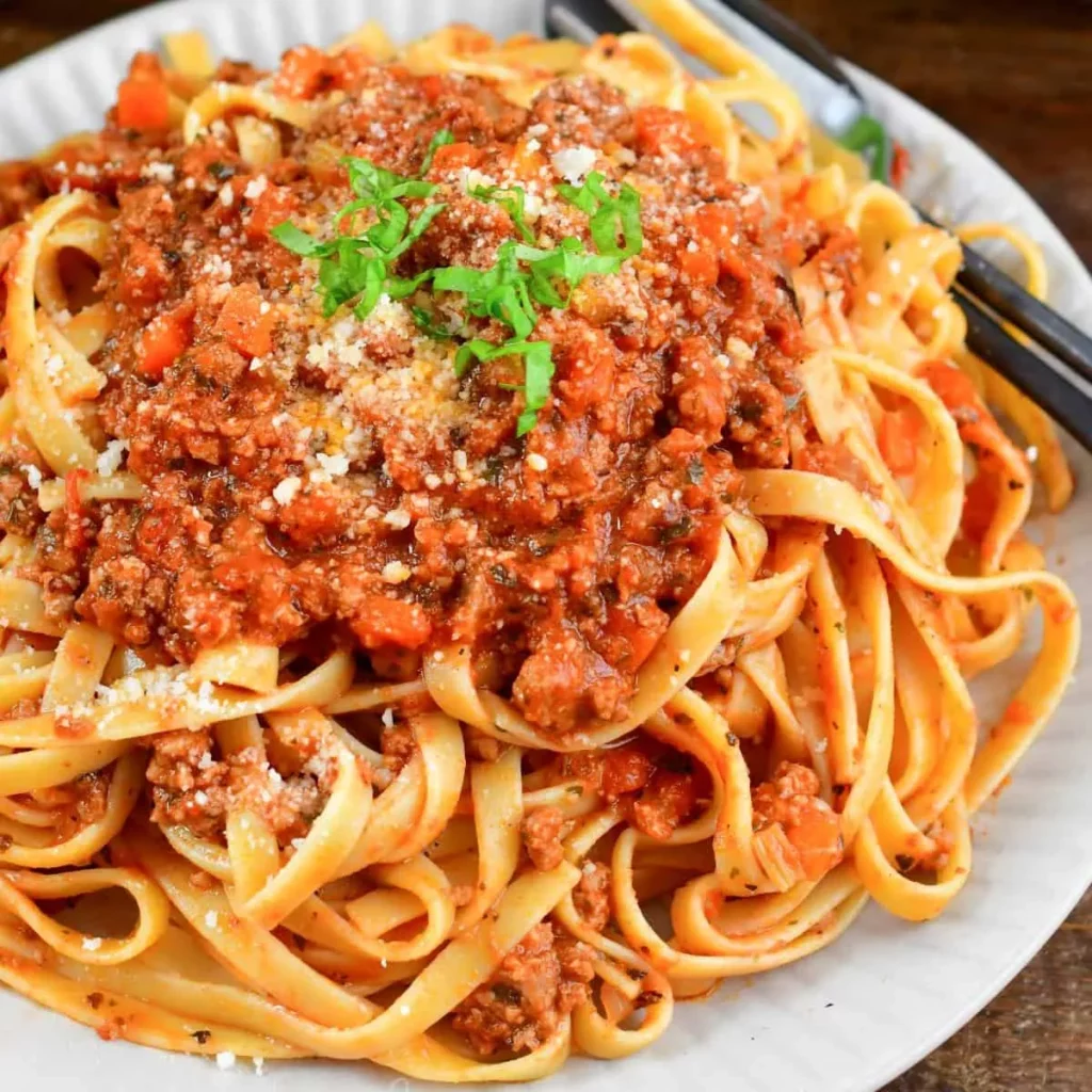 Bolognese sauce with pasta on a plate sq
