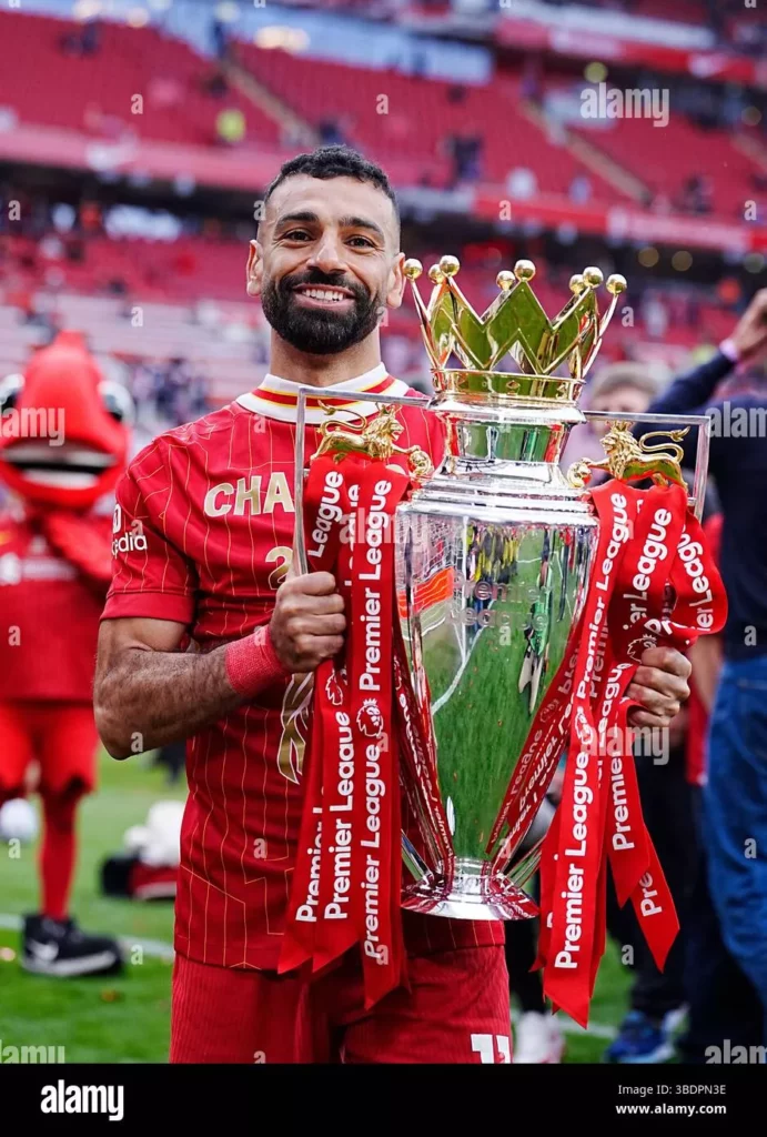 liverpools mohamed salah celebrates with the premier league trophy after the premier league match at anfield liverpool picture date sunday may 25 2025 3BDPN3E