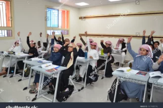 تكافل الطلاب متى ينزل الترم الثالث 1447؟ موعد الصرف وخطوات التسجيل والشروط 2 stock photo a classroom with a group of saudi arabian students with their teacher in a class saudi arabia in 1517499776