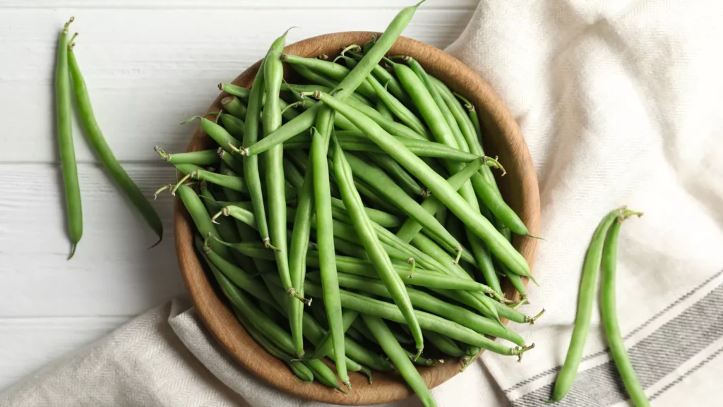 fresh green beans cooking in pot